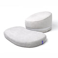 Light gray round meditation cushion and rectangular floor cushion on a white background.