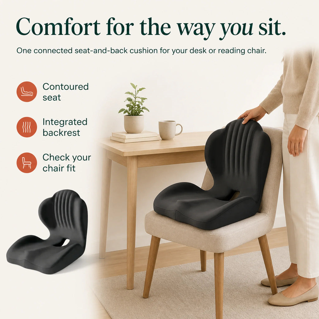 An adult positions the black seat-and-back cushion on a chair, with contoured seat, integrated backrest and chair-fit guidance.